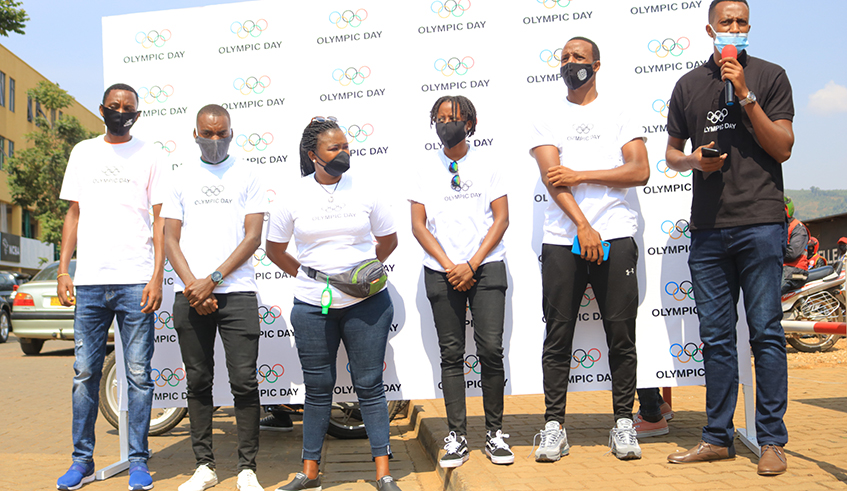 FÃ©licitÃ© Rwemalika (2nd-L) and other officials from the Rwandan sports community at the event to donate the hand sanitisers to taxi-moto riders in Downtown, Nyarugenge District, on Tuesday. / Courtesy.