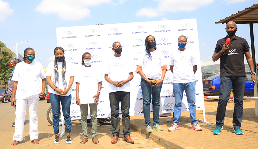 FÃ©licitÃ© Rwemalika (2nd-L) and other officials from the Rwandan sports community at the event to donate the hand sanitisers to taxi-moto riders in Downtown, Nyarugenge District, on Tuesday. / Courtesy.