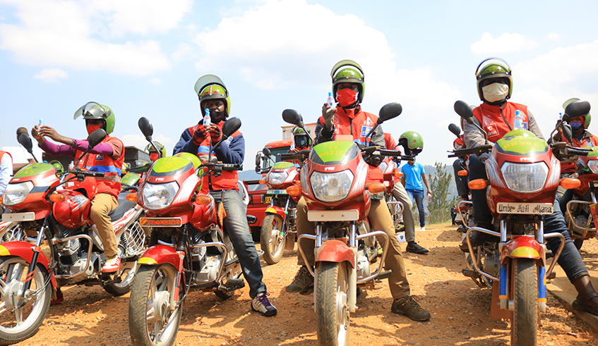 FÃ©licitÃ© Rwemalika (2nd-L) and other officials from the Rwandan sports community at the event to donate the hand sanitisers to taxi-moto riders in Downtown, Nyarugenge District, on Tuesday. / Courtesy.