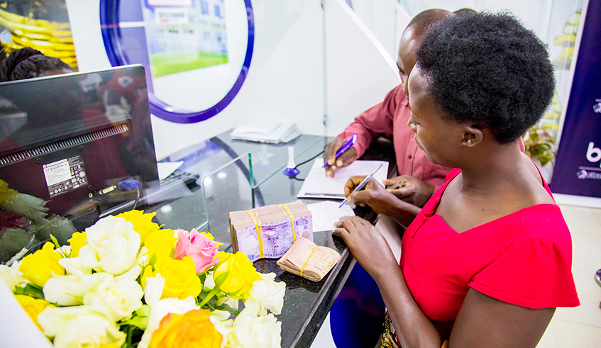 Banque Populaire du Rwanda Plc customers carry out transactions at the Nyabugogo Branch in Kigali in 2019. Since the Covid-19 outbreak in mid-March, commercial banks have reportedly restructured combined loans worth Rwf647 billion as part of the relief efforts towards distressed borrowers. / Photo: Sam Ngendahimana. 