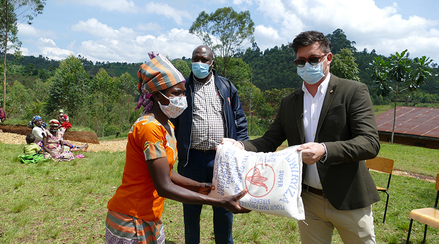 One&Only Nyungwe House General Manager, Jacques Le Roux is handing over supplies to the Gisakura community.