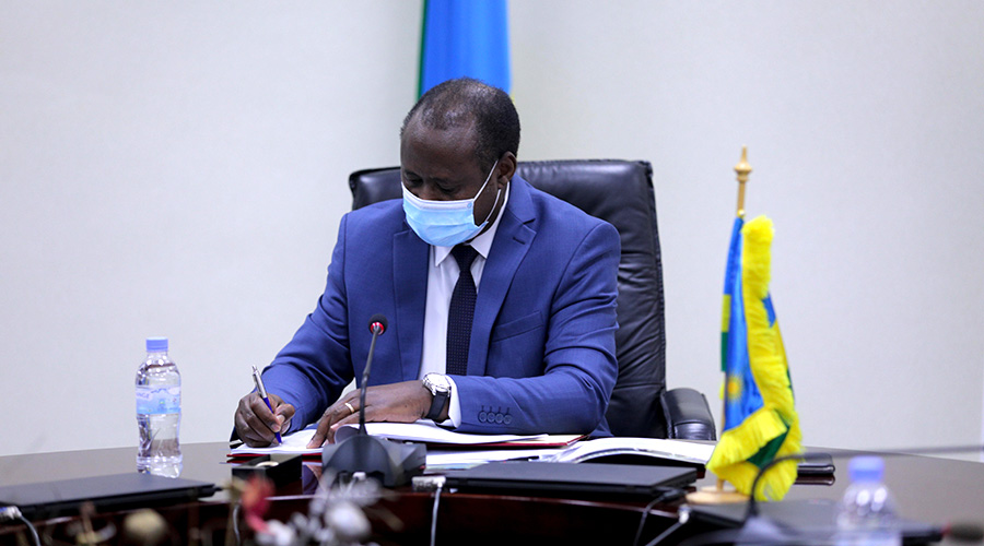 L-R: Leslie Marbury, USAID Mission Director and Uziel Ndagijimana, Minister of Finance after signing a Rwf605 billion deal to support the country's development efforts.Â / Dan Nsengiyumva
