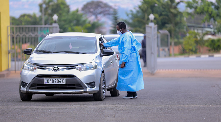 An RBC official measures the temperature of a driver during. Temperature testing was one of the things done by medics, before an oral sample was collected.