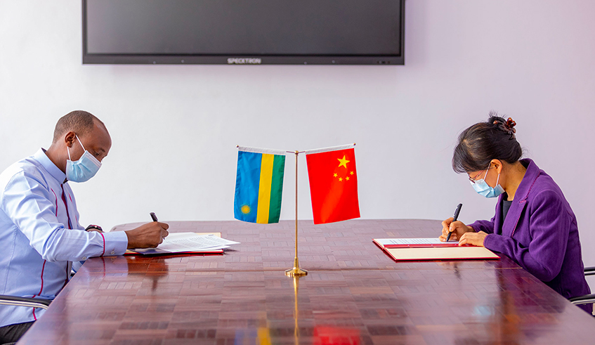 Dr Sabin Nsanzimana, the Director General of RBC (left), and Xing Yuchun, the Political Counsellor and Deputy Ambassador of China to Rwanda, sign documents related to a donation of Covid-19 equipment by Chinese First Lady to Rwanda. Rwanda has received medical supplies from the First Lady of China, bolstering the countryâ€™s efforts to combat Covid-19. / Photo: Courtesy