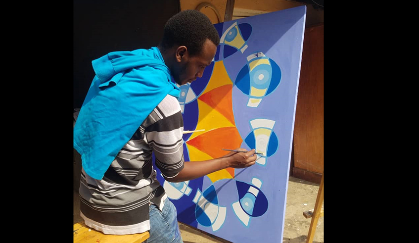 Mugabo doing one of his abstract paintings.
