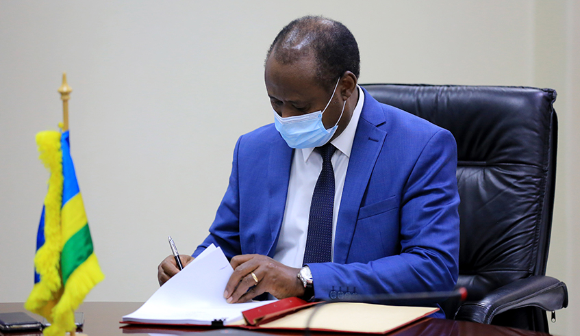 Minister of Finance and Economic planning Uzziel Ndagijimana  signing the MoU  in Kigali yesterday . / Sam Ngendahimana
