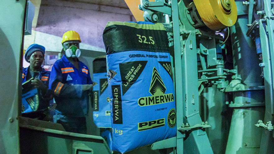 Workers fill bags with cement at Cimerwa. It has been about a month since locally manufactured cement from Cimerwa has gone scarce on the market. 