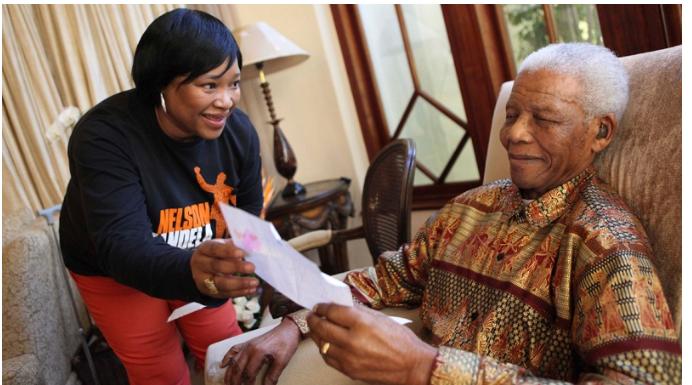 Former South African president Nelson Mandela sits with his youngest daughter Zindzi, a day before his 92nd birthday, at his home in Johannesburg on Saturday, July 17, 2010. (AP / Debbie Yazbek, Nelson Mandela Foundation)