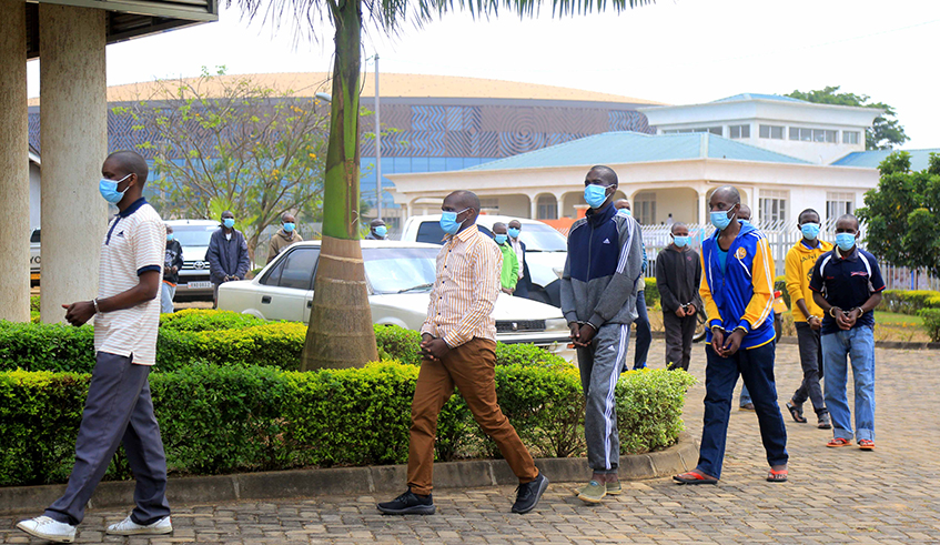 Some of the 57 suspects caught in acts of subversion against the country paraded before the media in Kigali yesterday. / All photos by Craish Bahizi