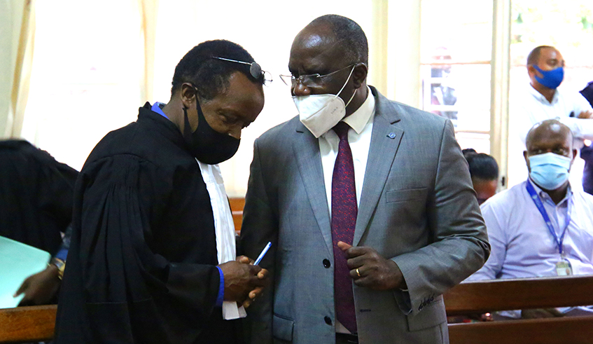 Habumuremyi consults with his lawyer at Gasabo Primary Court in Kigali on Thursday, July 16. / Photo: Craish Bahizi.