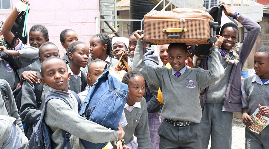 Pupils of Excel Academy in Nakuru County, Kenya prepare to go home on March 16, 2020 after the government ordered closure of all schools to combat spread of coronavirus. 