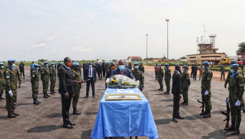 The President of Central African Republic, Faustin-Archange Touadu00e9ra pays his last respects to Sergeant-Major Edouard Nsabiyaremye, an RDF peacekeeper who was killed in an attack on July 13. 