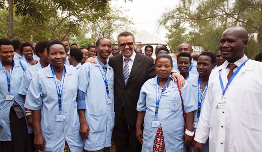Dr Tedros Adhanom Ghebreyesus, Director-General, World Health Organisation, poses with a group of community health workers at Mayange Health Centre in Bugesera in 2018. A top official involved with the fight against Covid-19 in the country has said the Government will soon turn to the more than 60,000 community health workers to help contain the pandemic. / File