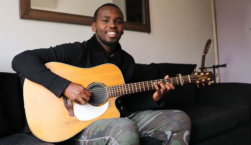 Deo Salvator Iratwumva is a  self-taught guitarist and  founder of Fingerpickers in Africa. / Photo by Joseph Njata.