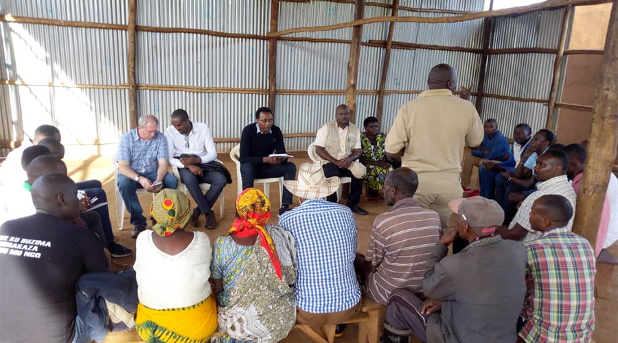 Staff from World vision and members of the National Oversight and Coordination Committee (NOCC) meeting with a farmer cooperative in Nyagatare District. 