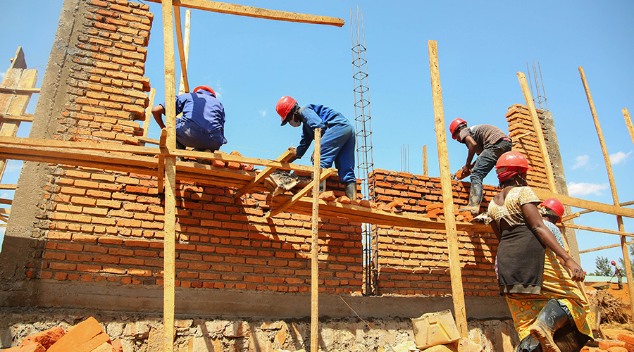 Workers construct new classrooms at Groupe Scolaire Rusheshe in Kicukiro District in May. The Government has set September as a proposed month within which public schools can resume, after many months of closure due to the Covid-19 pandemic. / Photo: Dan Nsengiyumva