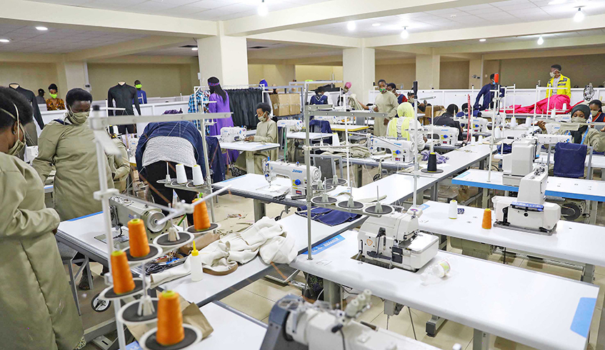 Workers make facemasks at Apparel Manufacturing Group Ltd in Kigali on April 20. / Photo: File.