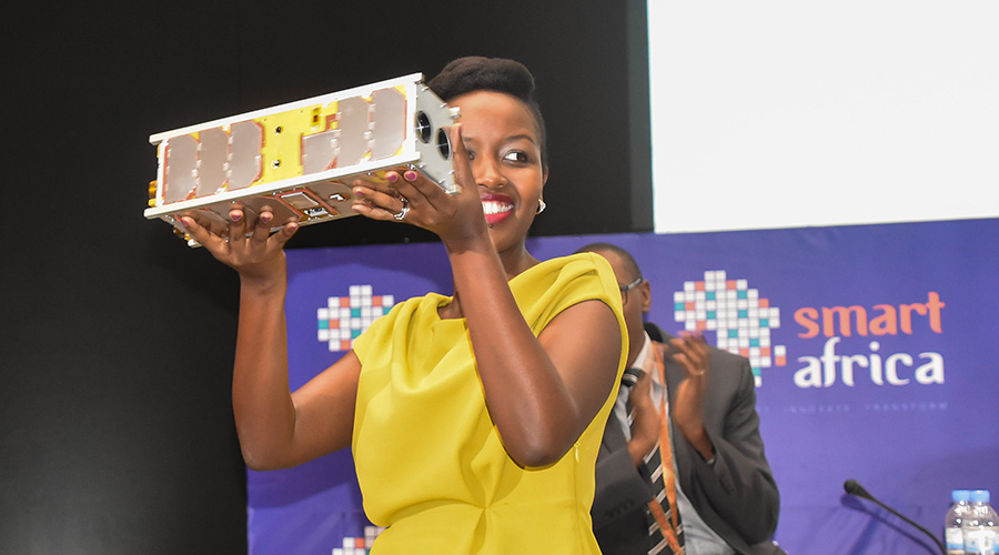 The Minister for ICT and Innovation Paula Ingabire holds Rwanda's first CubeSat, known as RWASAT-1, in Kigali on May 16, 2019. It was sent into orbit in November.  