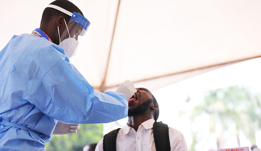 A medical staff conducts random Covid-19 tests at Amahoro Stadium site in Remera, Kigali on July 2. / Photo: File.