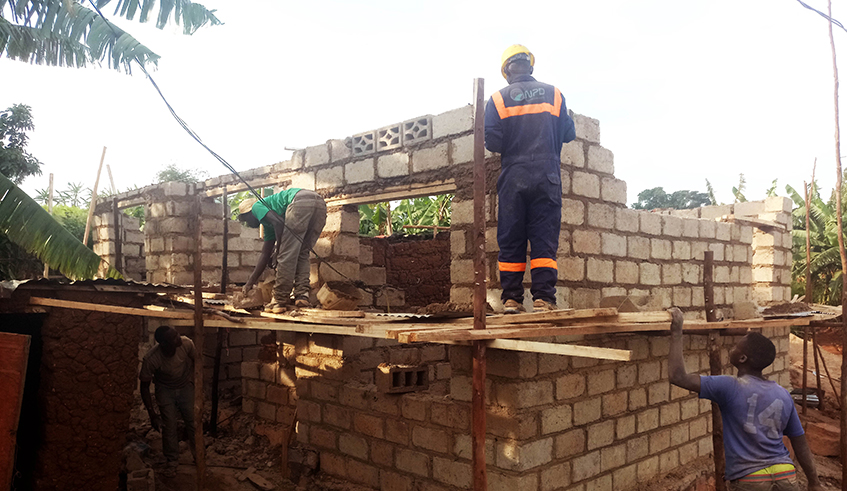 Construction workers on duties in Kigali. The cost of the building is proportional to the plot size. / Sam Ngendahimana.
