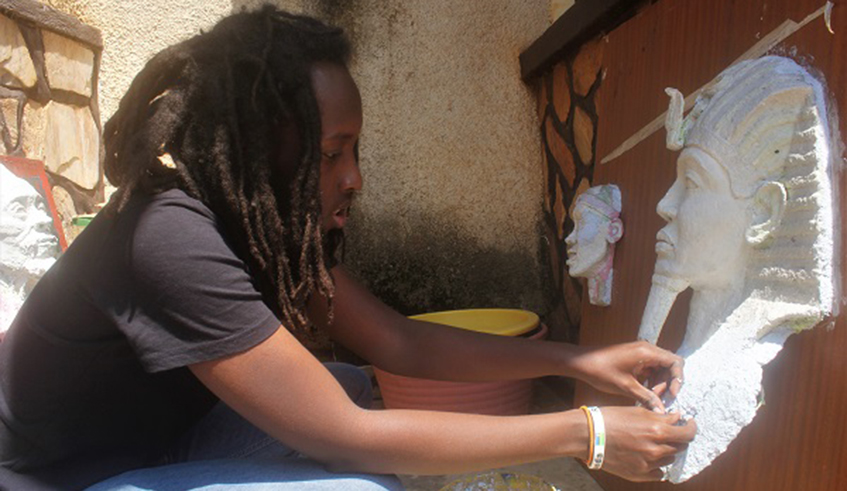 Emmanuel Ngabo sketching portraits at his residence in Gikondo. / Courtesy photos.