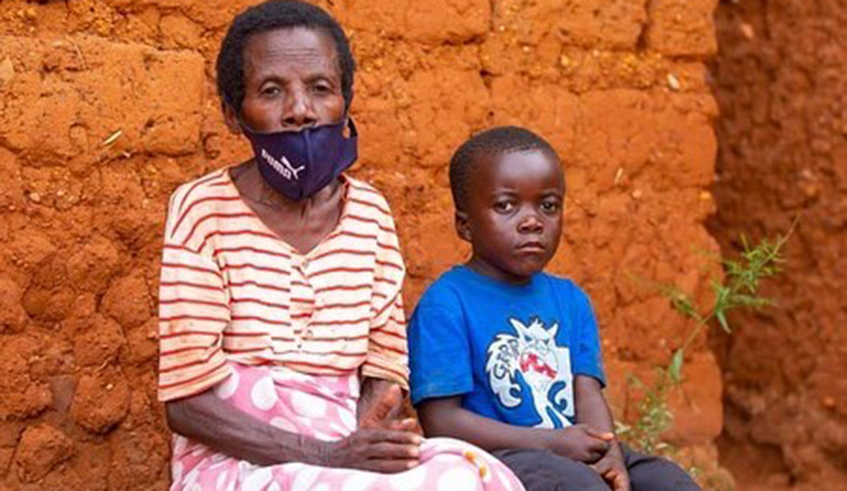 Young dancer Bright Karyugahawe with his grandmother at their home in Kanazi Cell, Bugesera District. / Courtesy. 
