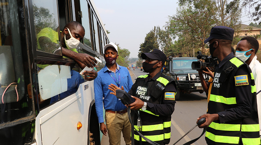 Police officers testing a public bus in Kigali to ascertain the quality of air it emits on Saturday.