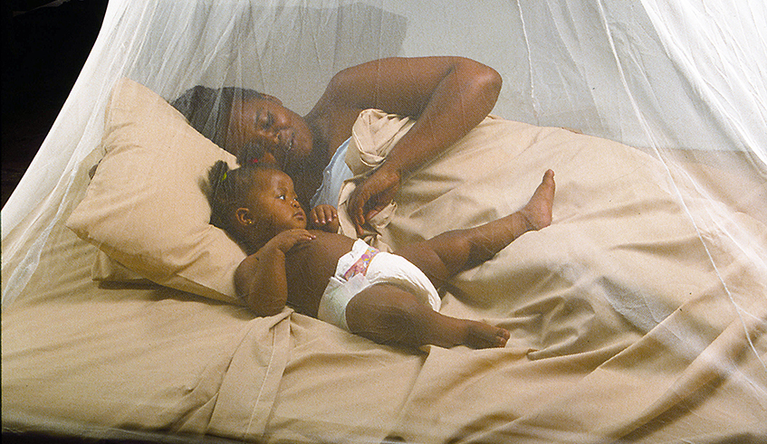 A mother with her baby under a mosquito net. According to a report by the Ministry of Health on Malaria and Neglected Tropical Diseases, severe malaria cases dropped by 38% in 2019/20 fiscal year, thanks to home-based management interventions, free treatment of malaria for Ubudehe Categories I and II, and the quality of care at health facilities. / Photo: File.