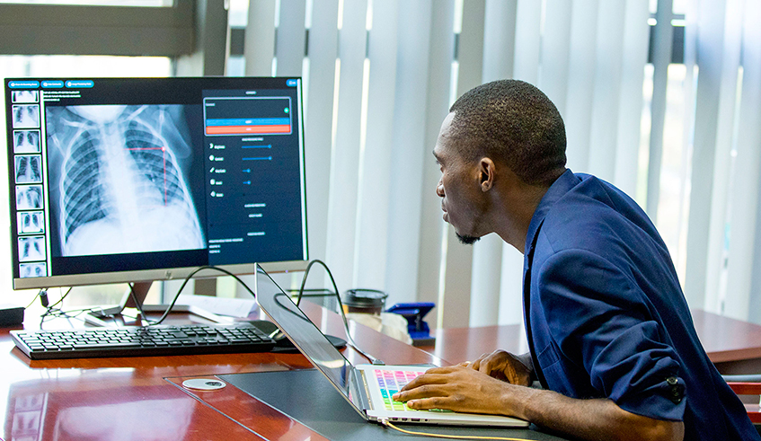 Audace Nakeshimana, the founder of Insightiv,  a Rwandan startup, demonstrates how Artificial Intelligence algorithms can be used in automated detection of Covid-19 from medical images. / Photo: File.