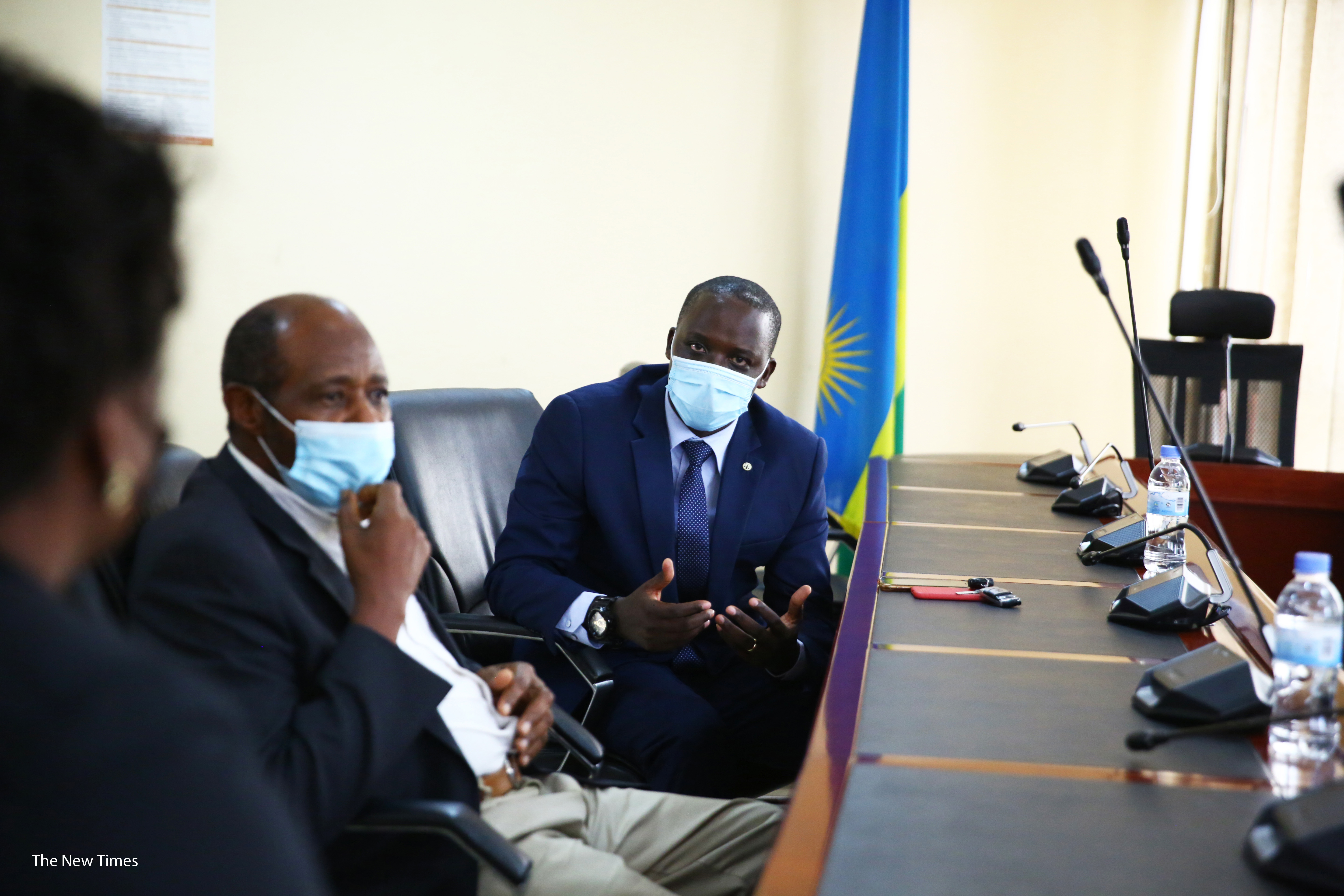 Lawyer David Rugaza (left) interacts with Paul Rusesabagina.