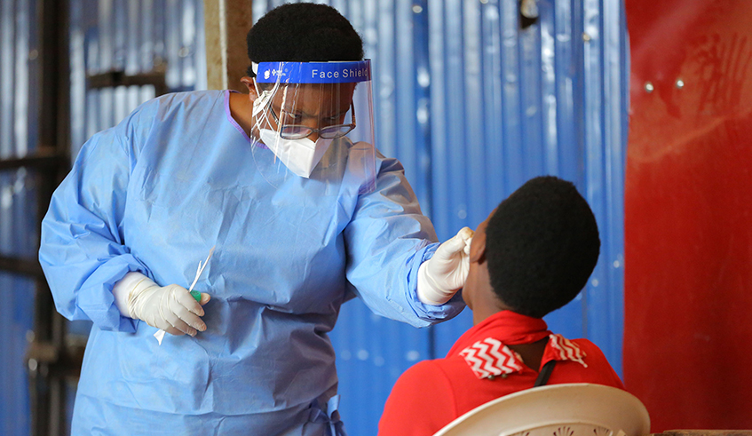 A health worker conducts a Covid-19 test in Kigali recently. / Photo: Dan Nsengiyumva.