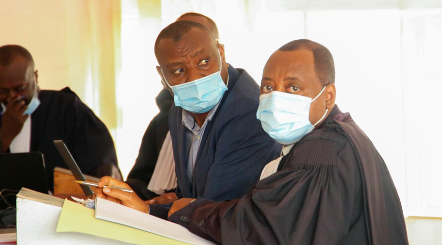The former Minister of State for Education Dr Isaac Munyakazi with his lawyers during the hearing at Nyarugenge Intermediate Court in Kigali. 