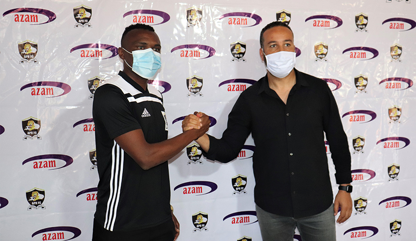 Jacques Tuyisenge (L) and APR head coach Adil Erradi after the player was unveiled on Friday. / Craish Bahizi