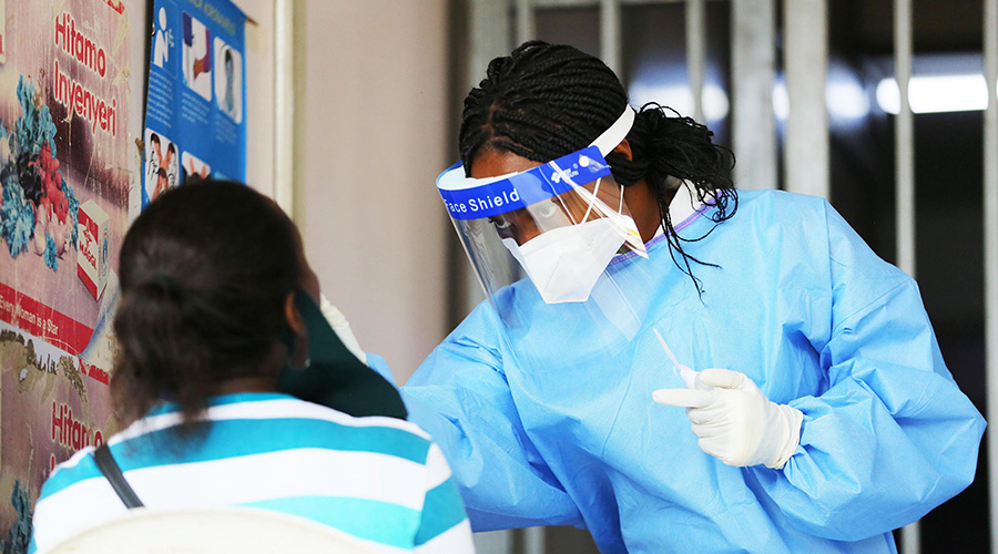 A health worker conducts a Covid-19 test in Kigali recently. RBC has revealed that about 762 Covid-19 patients have been admitted to home-based care. 