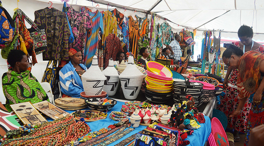 Women sell different handcraft products in mini exhibition at Kigali car-free zone last year. So far 74 per cent of women lie within the informal business sector. 