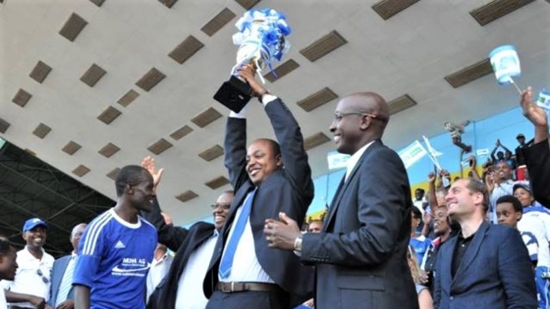Abdallah Murenzi (holding the trophy) was Rayon Sports' president as the club lifted their seventh league title in 2013. 