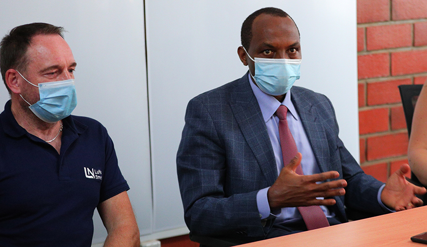 Francis Gatare (right) addresses the media as Robert Nowak, the Managing Director of LuNa Smelter, looks on in Kigali on Tuesday, September 22. / Sam Ngendahimana.