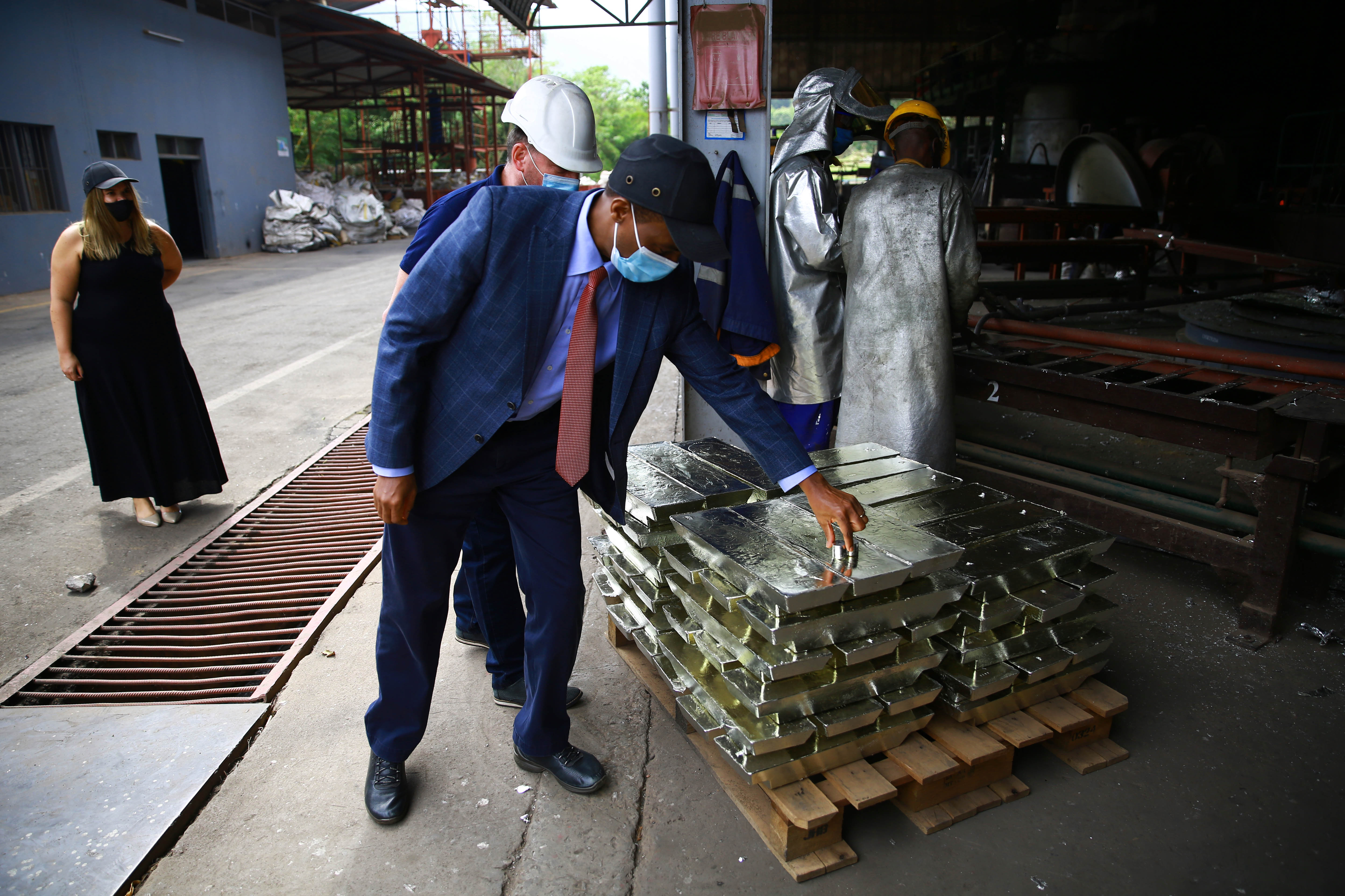 Francis Gatare and Robert Nowak, the Managing Director of LuNa Smelter  tour inside the firm in Kigali on 22 September