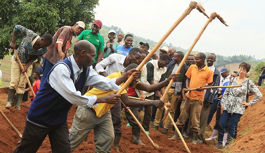 Residents at work under the Vision Umurenge Programme (VUP) in Kamonyi District last year. / Photo: Sam Ngendahimana.