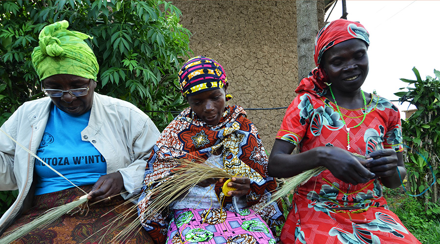 Women weave traditional baskets using local products in Musanze District. 
