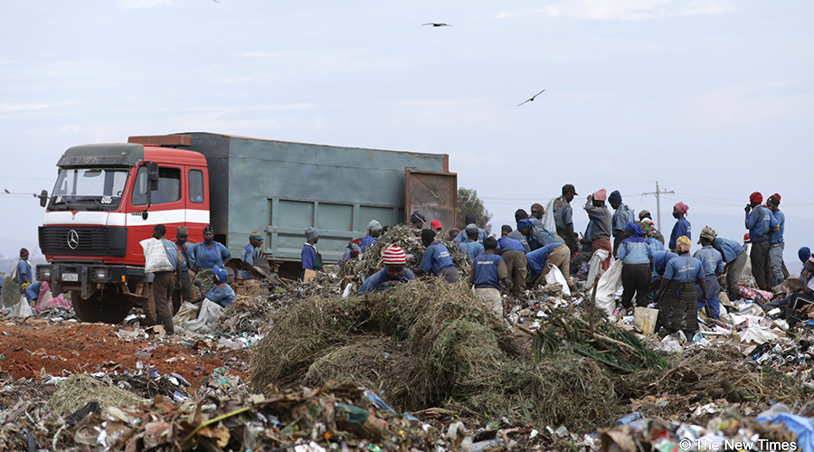 Workers sort garbage at Nduba Dump Site in Muremure Cell, Nduba Sector in Gasabo District. 