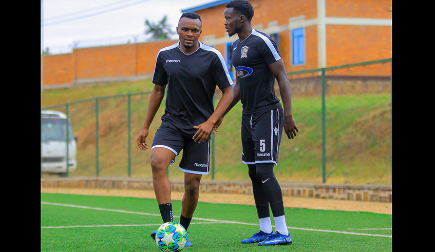 Jacques Tuyisenge (L), seen here with centre-back Ange Mutsinzi training at Shyorongi artifical turf last week, joined APR on a two-year deal last month. The forward is the assistant captain for the national team Amavubi. / Photo: Courtesy.