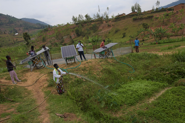 Farmers in Ngoma sector, Rulindo district, irrigating their vegetables using solar-powered system. 