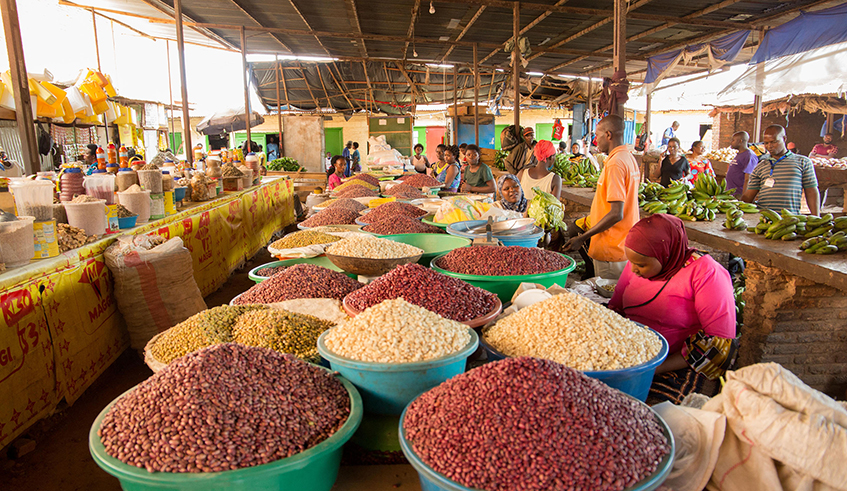 Foodstuff vendors at Kimisagara market. The prices of food items such as potatoes, rice, peas, beans and tomatoes have been going up, leading to concerns on food security and affordability in the country. / Photo: Craish Bahizi.