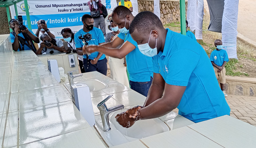 Lambert Karangwa, Senior WASH Expert at Water Aid-Rwanda and the Mayor of Nyamagabe during the Global handwashing day. Courtesy.