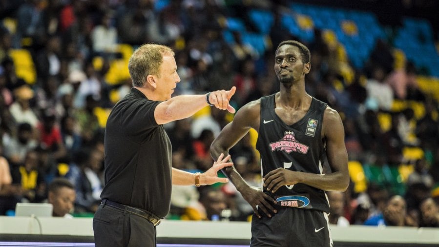 Patriots head coach Dean Murray gives instructions to point guard Sedar Sagamba during a past league game against Espoir at Kigali Arena earlier this year. The two sides go head-to-head again on Sunday, same venue. /Courtesy photo