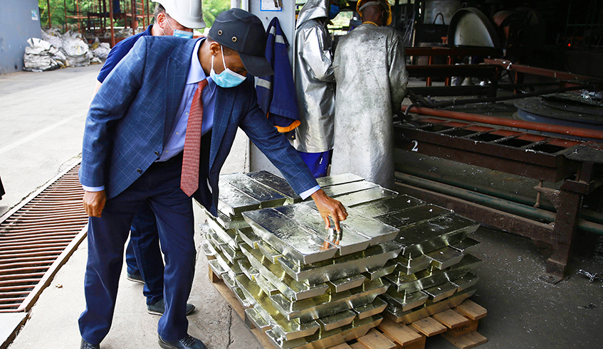 Francis Gatare, the Chief Executive of the Rwanda Mines, Petroleum & Gas Board and Robert Nowak, the Managing Director of LuNa Smelter tour the sole producer and exporter of tin in both Eastern and Central Africa. Rwanda is keen on increasing mineral exports to offset its trade deficit. / Photo: Sam Ngendahimana. 