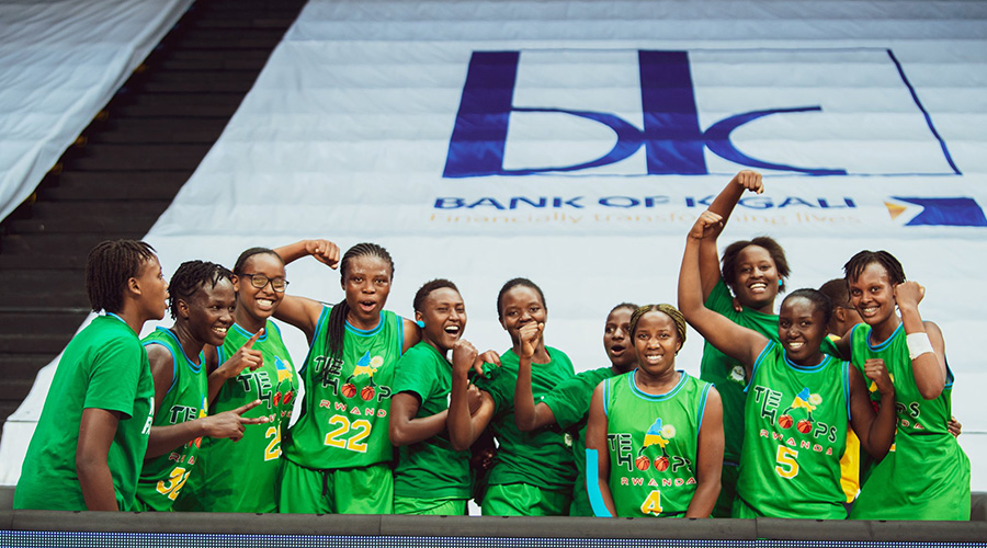 The Hoops Rwanda players celebrate after beating IPRC Huye 68-63 to win their first league title at Kigali Arena on Saturday. 