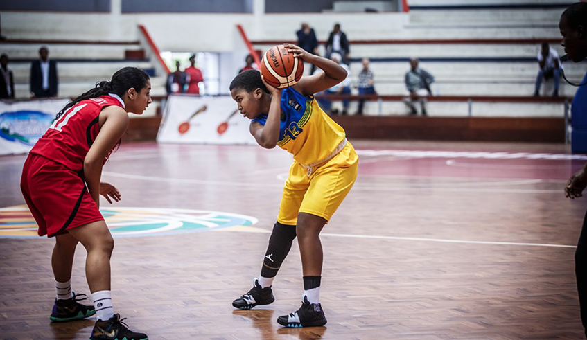 Stella Ineza Ndahiro (R) is seen here in action during Rwanda's group game against Egypt at the 2018 Fiba U-18 Women's African Basketball Championship in Mozambique. Rwanda finished fourth in the tournament. / Net