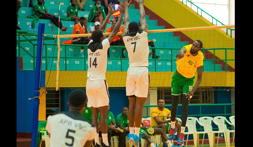 APR players block a spike from UTBu2019s left-attacker Nelson Murangwa during the game at Petit Stadium on Wednesday. / Photo: Courtesy.